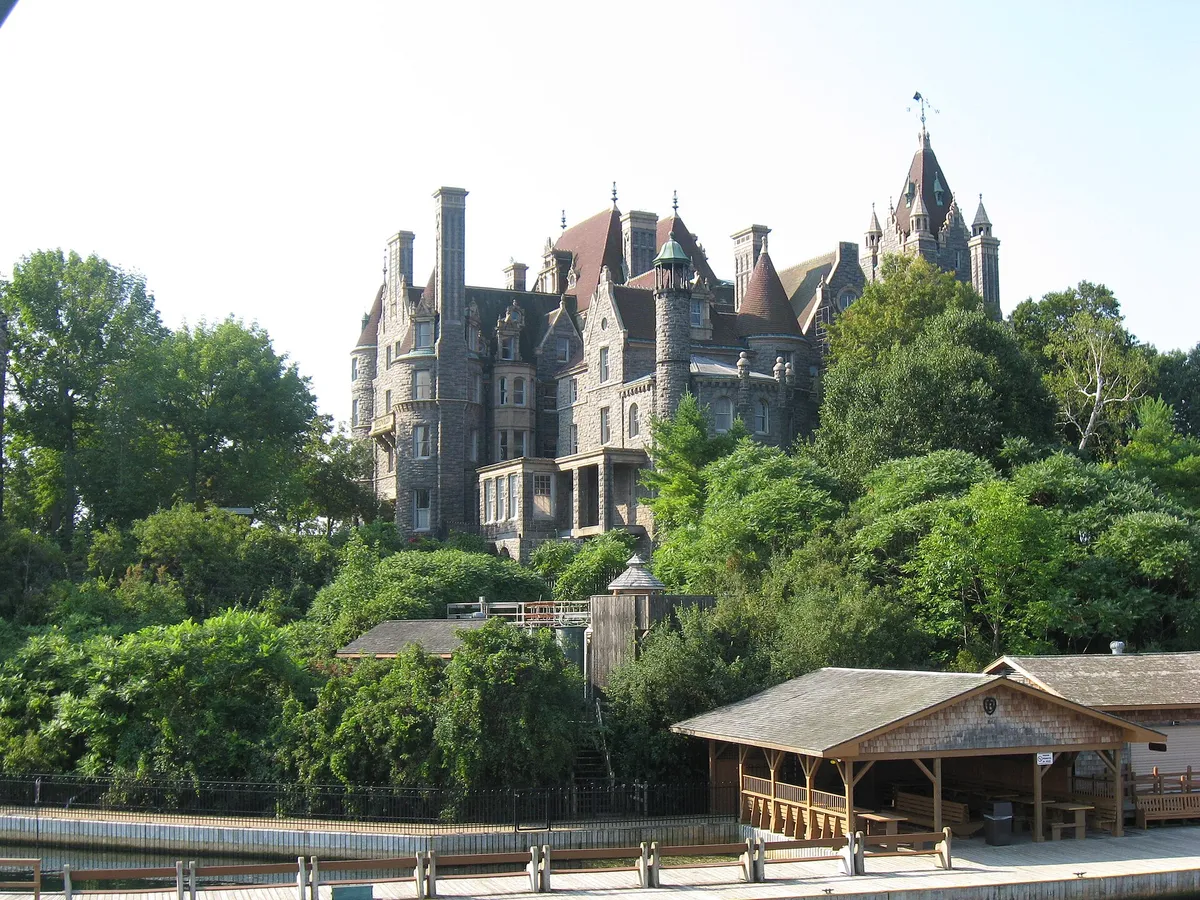 Boldt Castle turrets rising above Heart Island seen from a Gananoque boat tour 1000 Islands cruise on the St. Lawrence River