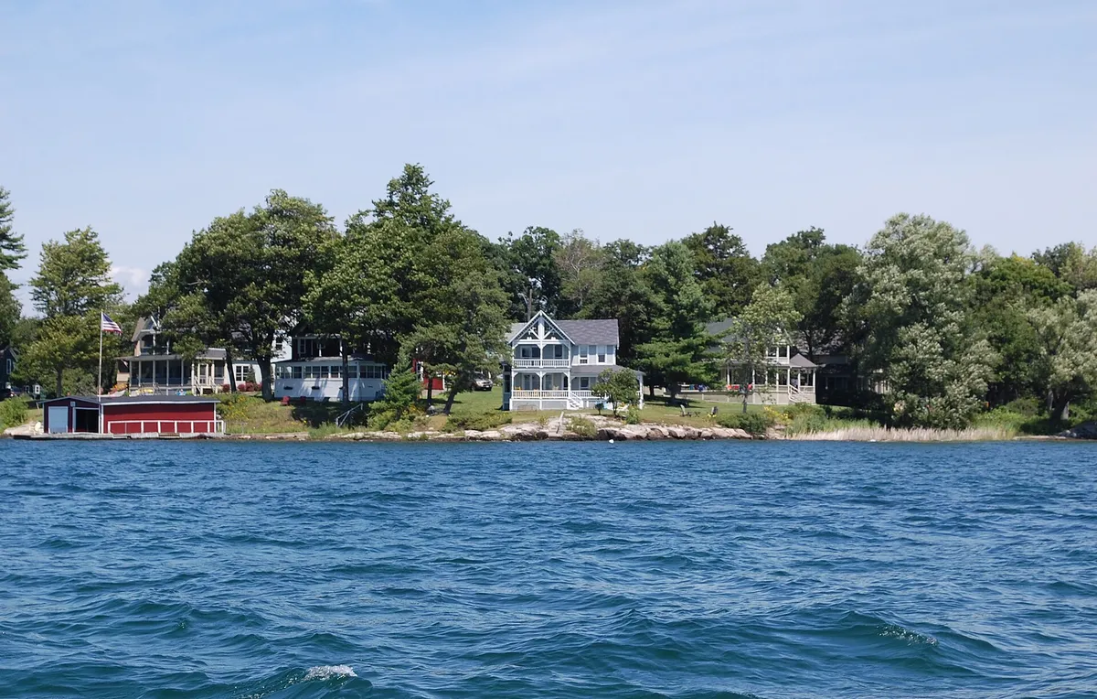 Gilded Age island mansions along Millionaire's Row viewed from a Gananoque boat tour of the 1000 Islands on the St. Lawrence River